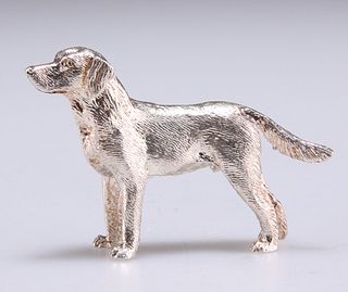 AN ELIZABETH II CAST SILVER MODEL OF A DOG, London 2009. 4.