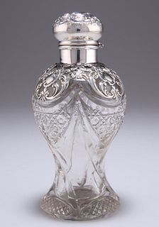 AN EDWARDIAN SILVER-MOUNTED CUT-GLASS SCENT BOTTLE, by Levi