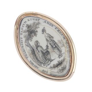 A mid 19th century memorial ring. Of marquise-shape outline, the white background with painted scene