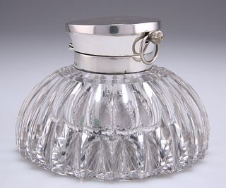 AN EDWARDIAN SILVER-TOPPED CUT-GLASS INKWELL WITH INTEGRAL 