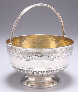A VICTORIAN SILVER SWING-HANDLE SUGAR BOWL, by Henry Hollan