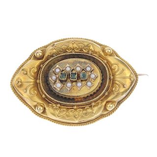 A late 19th century gold gem-set memorial brooch. Of marquise-shape outline, the foil back green-gem