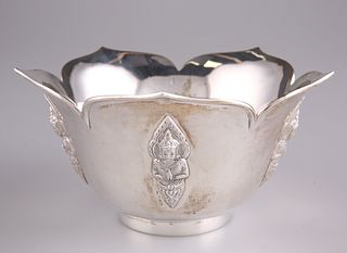 A FOREIGN STERLING SILVER LOTUS BOWL, decorated with Buddhi