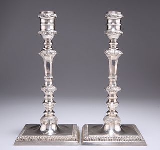 A PAIR OF GEORGE III STYLE CAST SILVER CANDLESTICKS, by C J