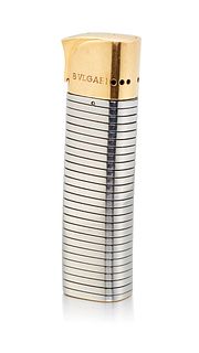 A BULGARI 'TUBOGAS' STAINLESS STEEL AND SILVER-GILT LIGHTER