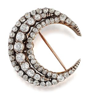 A VICTORIAN DIAMOND CRESCENT BROOCH, three rows of old-cut 