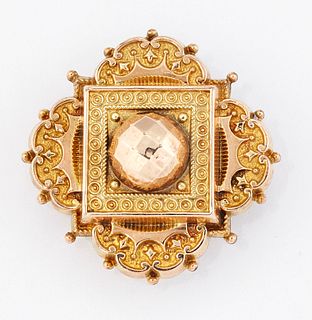 A VICTORIAN ETRUSCAN REVIVAL BROOCH, quatrefoil form with b