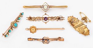 A GROUP OF SIX LATE VICTORIAN AND LATER BROOCHES, including