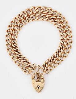 A 9CT GOLD BRACELET, as a double row of curb links, to a 9c