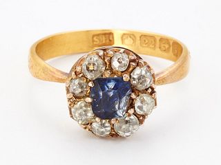 A 22CT GOLD SAPPHIRE AND DIAMOND CLUSTER RING, a cushion-cu