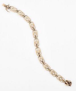 A BRACELET, of textured and pierced oblong links, marked ‘9
