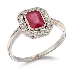A RUBY AND DIAMOND CLUSTER RING, an octagonal-cut ruby with