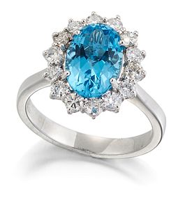 A BLUE TOPAZ AND DIAMOND CLUSTER RING, an oval-cut blue top