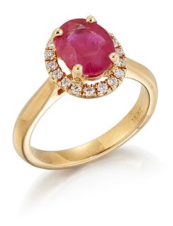 AN 18CT GOLD RUBY AND DIAMOND CLUSTER RING, an oval-cut rub
