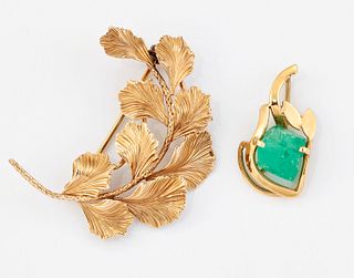 AN EMERALD PENDANT, a rough emerald crystal with a scroll a