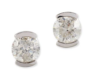 A PAIR OF 9CT WHITE GOLD SOLITAIRE DIAMOND EARRINGS, round 
