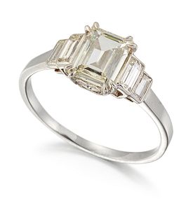 A DIAMOND RING, an octagonal-cut diamond in a double claw s