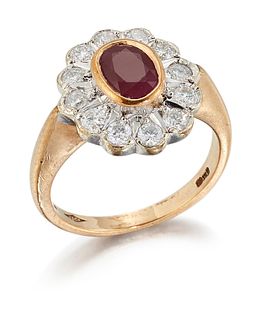 A 9CT GOLD RUBY AND DIAMOND CLUSTER RING, an oval-cut ruby 