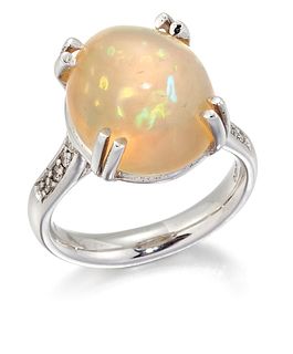 AN 18CT WHITE GOLD OPAL AND DIAMOND RING, an oval cabochon 