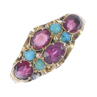 A mid Victorian gold gem-set ring. The twin oval-shape garnets, to the similarly-shaped garnet sides