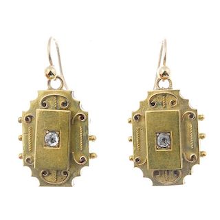 A pair of late 19th century gold diamond ear pendants. Each designed as an old-cut diamond, within a