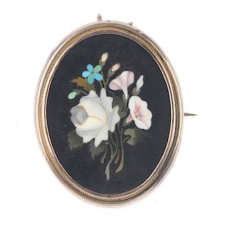 A late 19th century pietra dura brooch. Of oval-shape outline, the pietra dura panel depicting a bun