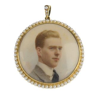 An early 20th century 15ct gold seed pearl portrait pendant. Of circular outline, the seed pearl sur
