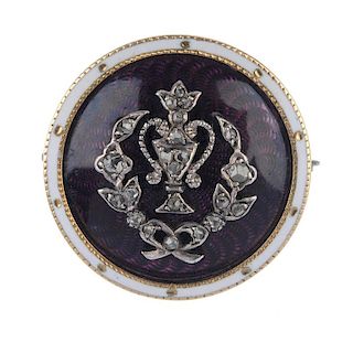 An Edwardian Baronial, gold, diamond and enamel mourning brooch. The rose-cut diamond trophy and wre