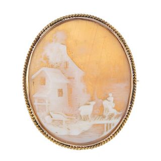 A cameo brooch. The shell depicting a mill and pastoral scene, to the rope-twist surround. Length 4c