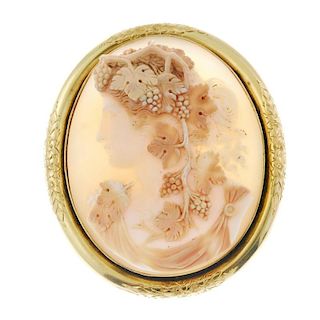 A mid 19th century gold shell cameo brooch. The oval-shape shell cameo carved to depict a bacchante,