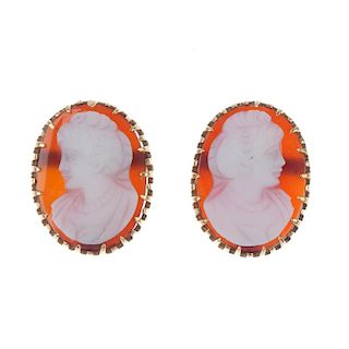 A pair of hardstone cameo ear studs. Each designed as a hardstone cameo carved to depict the side pr