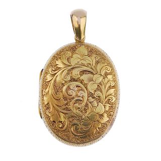 A late 19th century gold locket. Of oval outline with engraved acanthus leaf decoration. Length 4.2c