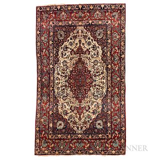 Isphahan Rug, Iran, c. 1920, featuring a complex red medallion on an ivory flower-filled field