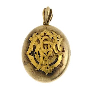 A late 19th century gold locket. Of oval outline, the front with raised initial monogram, suspended