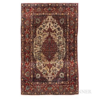 Isphahan Rug, Iran, c. 1920, featuring a complex red "pulled" medallion on an ivory flower-filled field