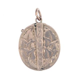A late 19th century 9ct gold outer locket. Of oval outline with engraved foliate, Greek-key and tria