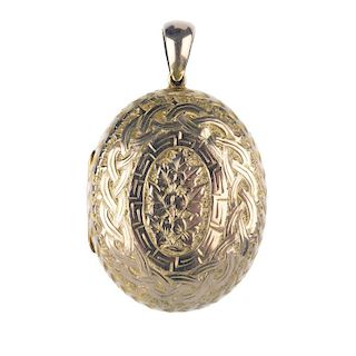 A late 19th century gold locket. Of oval outline, the engraving to the front combining a Celtic plai