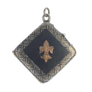 A niello locket. The fleur-de-lys, to the crosshatch border and similarly-designed reverse. Length 3