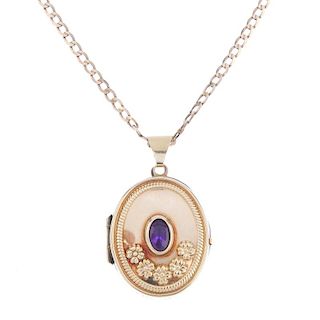 Two 9ct gold gem-set lockets and a 9ct gold chain. To include a 9ct gold oval-shape engraved locket