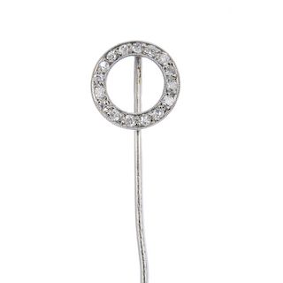 An early 20th century platinum diamond stickpin. Designed as a single-cut diamond circle, to the pla
