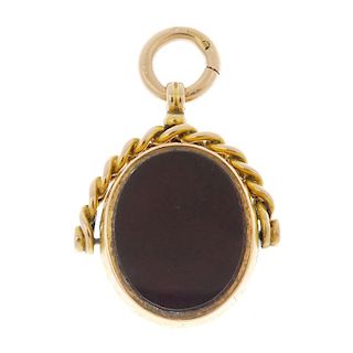 A late Victorian 15ct gold bloodstone and carnelian fob. The swivel fob with oval-shape bloodstone t