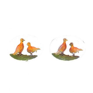 Two cast glass intaglios. The indentations painted as two game birds on grass with a clear backgroun