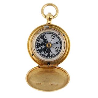 An early 20th century 18ct gold compass fob. The circular-shape plain case, opening to reveal a moth