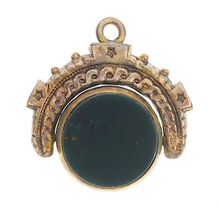 Two late 19th century hardstone items. To include a 9ct gold carnelian and bloodstone swivel fob wit