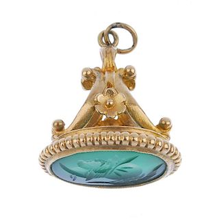<p>A gold gem-set fob. The oval-shape green chalcedony with intaglio depicting the head of a centuri