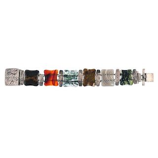 A mid 20th century Scottish agate bracelet. Designed as a series of rectangular-shape tapered agate