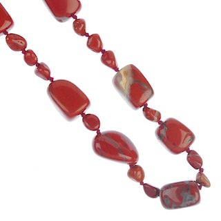 Four agate and hardstone necklaces. To include a dyed agate necklace, the magenta beads alternating