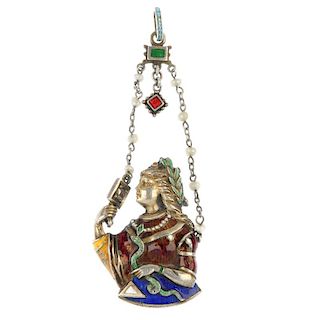 An Austro-Hungarian enamel and diamond pendant. Depicting an elegant lady wearing a red, blue and ye