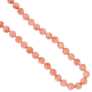 A coral necklace. Designed as a single-row of forty-eight spherical beads measuring 7.7 to 7.8mms, t