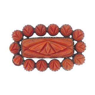 Three items of coral jewellery. To include a mid Victorian carved coral memorial brooch, designed as